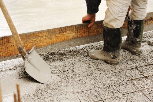 working pour concrete for pole building foundation